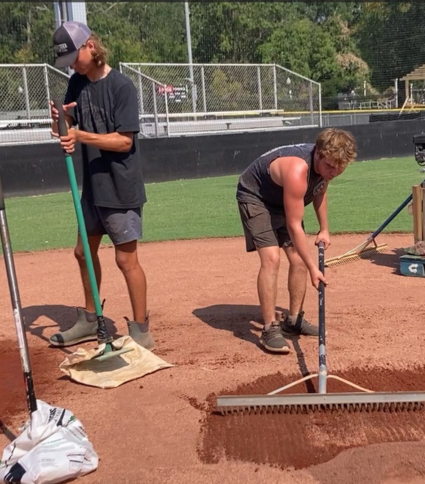 Workers spread new clay and dirt on the Pelham youth baseball fields.
