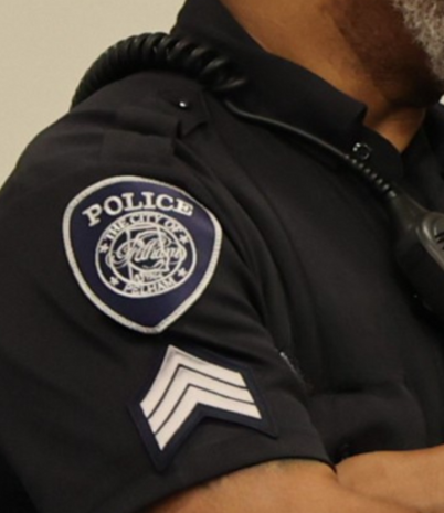 The sleeve of a Pelham Police officer is shown with the PPD logo and sergeant chevrons.